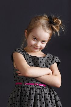 Six years old girl posing in the studio