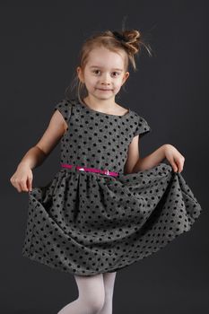 Six years old girl posing in the studio