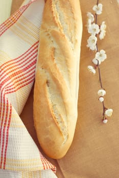 White bread loaf near the napkins on the table