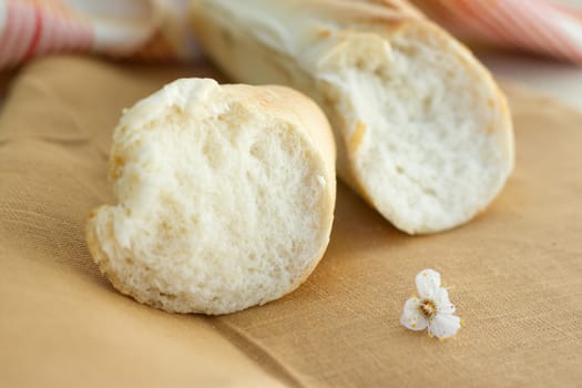 White bread loaf near the napkins on the table