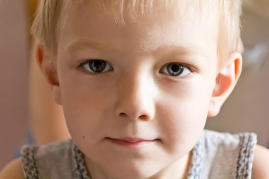 Portrait of cute boy with blond hair