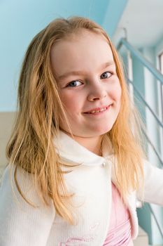 Portrait of cute girl with blond hair