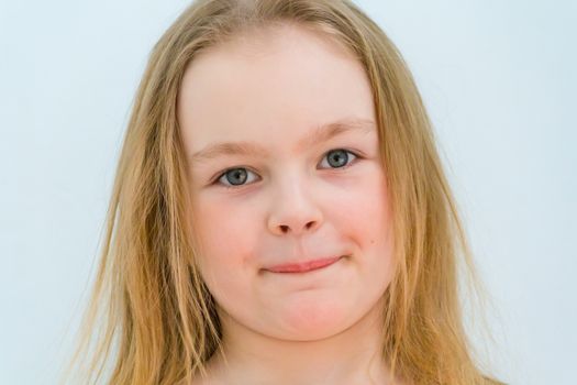 Portrait of cute girl with blond hair