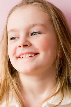 Portrait of cute smiling girl with blond hair