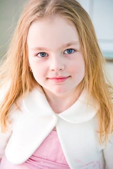 Portrait of cute girl with blond hair