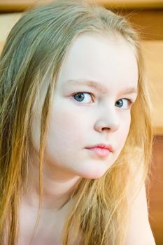 Portrait of cute girl with blond hair