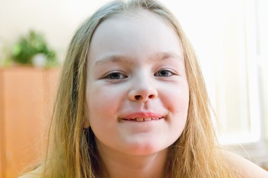 Portrait of cute girl with blond hair