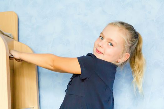 Photo of cute girl on gymnastic stairway