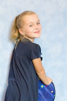 Portrait of cute girl with blond hair