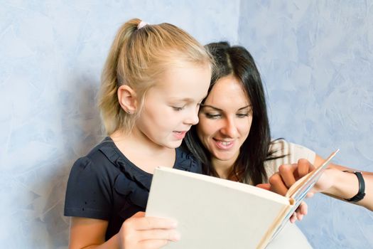 Photo of mother and daughter is younger schoolgirl