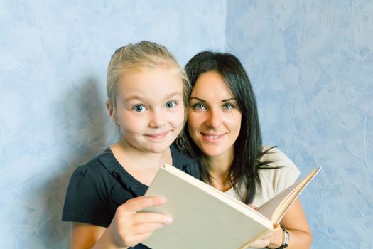 Photo of mother and daughter is younger schoolgirl