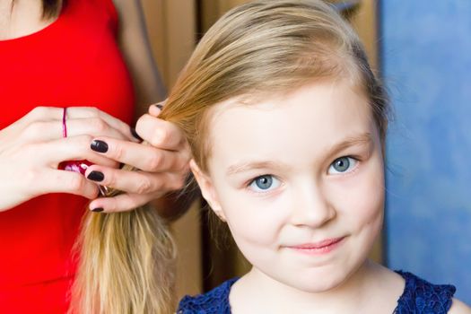 Portrait of cute girl with blond hair