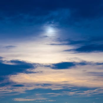 Sunset in the evening sky with clouds and blue sunny red from the sun.