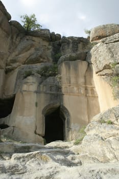 A view to Kalburlu Church. The church is historical, natural and inside the rocky hill. Photo taken at open air museum in Guzelyurt/Aksaray/T urkey.