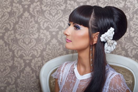 Bride with a beautiful hairstyle and makeup gorgeous close-up portrait