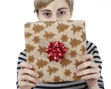 Young woman holding a present in hands