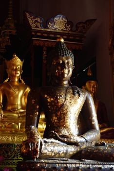 golden buddha images at Chiangrai twmple,Thailand