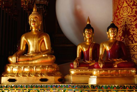 three of golden buddha images at Chiangrai temple,Thailand