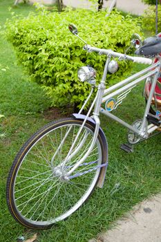 Bike has lights on the front. Bike with larger wheels are unique.
