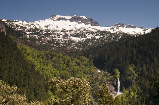 Water falls off the mountains in the North Cascades