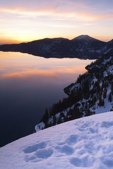 The sun comes up to light the scene at crater lake