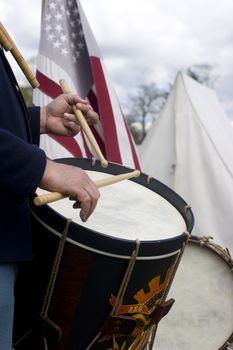 A military drummer plays his drum