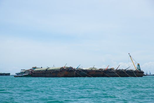 large cargo ship. Moored offshore. Transport near the docks.