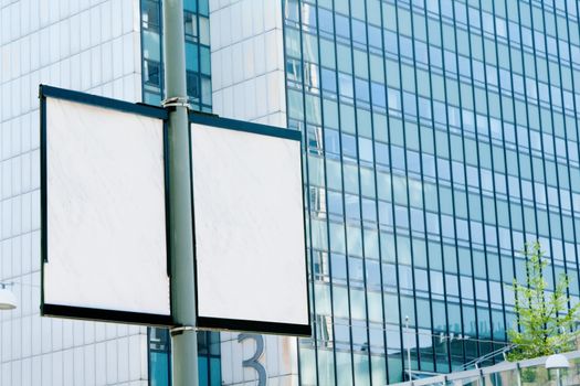 Outdoor billboards in the background of an office building