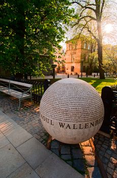 A large stone ball on the way to the temple with inscriptions