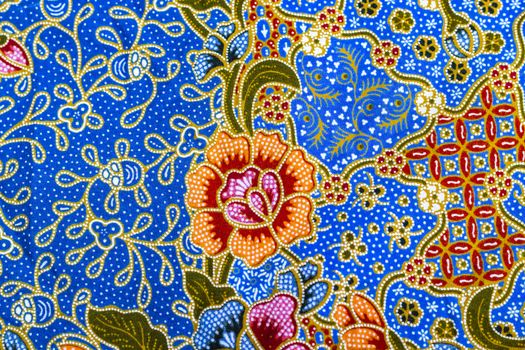 Beautiful orange flower pattern on batik background