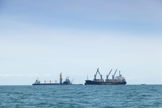 large cargo ship. Moored offshore. Transport near the docks.