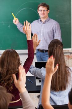 colledge students in auditorium at lesson 