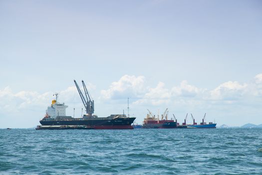 large cargo ship. Moored offshore. Transport near the docks.