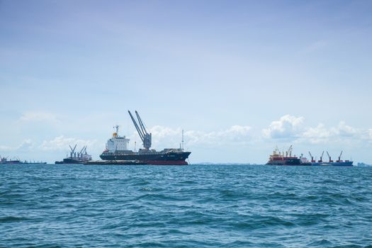 large cargo ship. Moored offshore. Transport near the docks.
