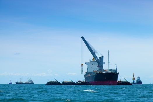 large cargo ship. Moored offshore. Transport near the docks.