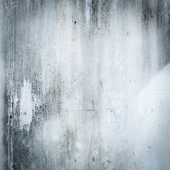 Old cement wall with traces of corrosion stains.