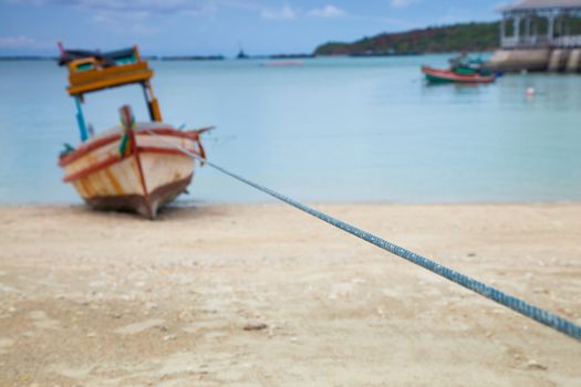 Small fishing boat. Parked on the beach. Ships were made of wood.