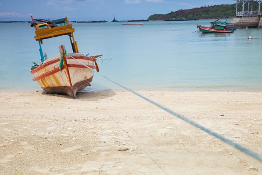 Small fishing boat. Parked on the beach. Ships were made of wood.