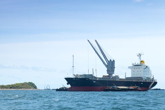large cargo ship. Moored offshore. Transport near the docks.