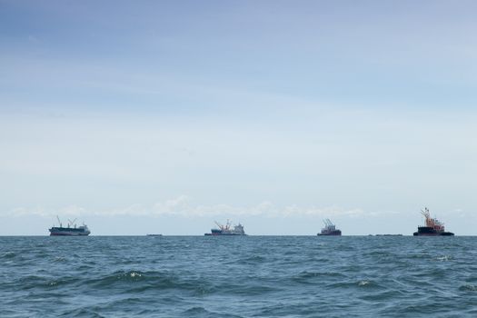 large cargo ship. Moored offshore. Transport near the docks.