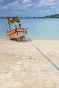 Small fishing boat. Parked on the beach. Ships were made of wood.