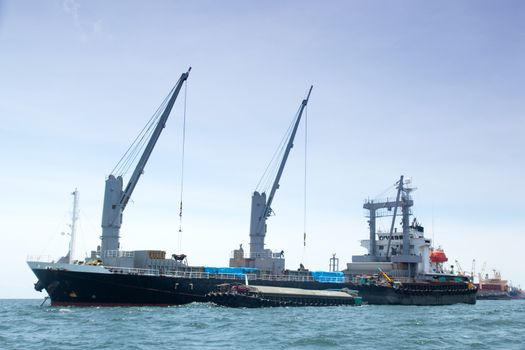 large cargo ship. Moored offshore. Transport near the docks.