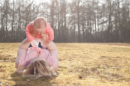 Mother and daughter on a sunny day in the field