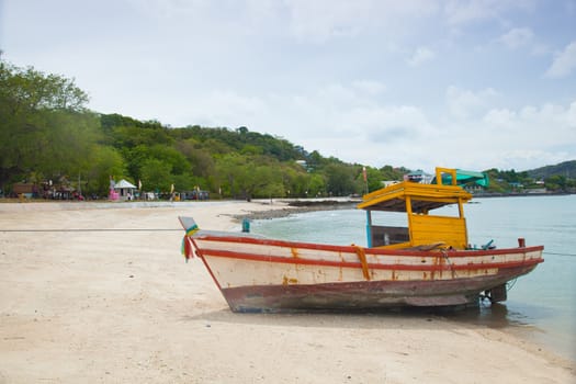 Small fishing boat. Parked on the beach. Ships were made of wood.