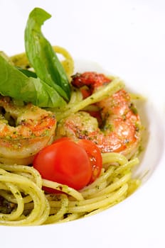 Spaghetti with sauce pesto and shrimps macro