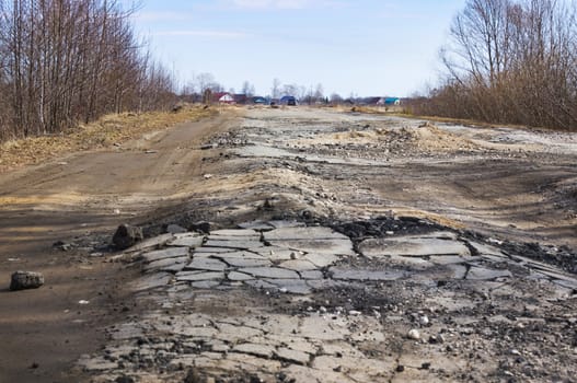 The asphalted road not handle heavy loads. Spring