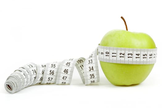 green apple with a measuring tape and heart symbol isolated on white background 