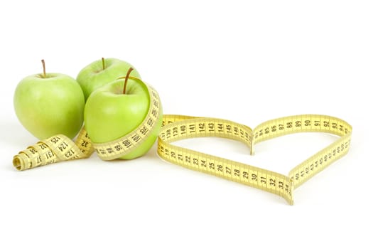 green apple with a measuring tape and heart symbol isolated on white background 