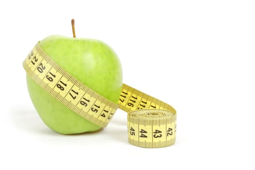 green apple with a measuring tape and heart symbol isolated on white background 