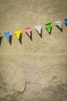 Grungy Retro Bunting Against An Old Building Wall